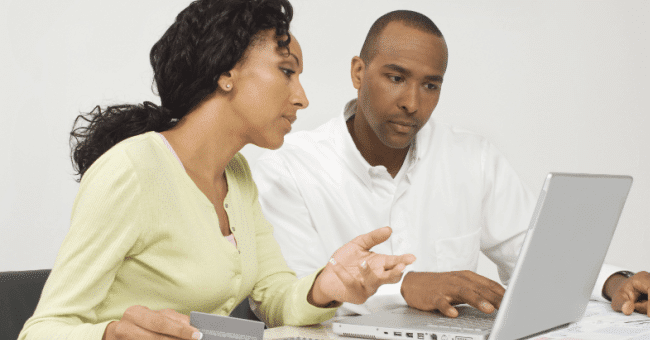 Accelerating digital transformation with CCM Technology-african american couple paying bills online