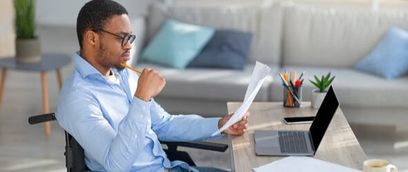 Businessman reading about Patient Communications and Client Onboarding Best Practices.