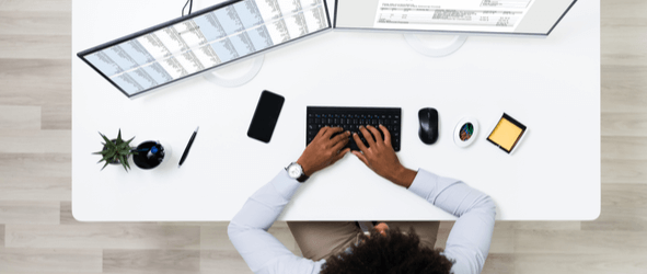 Overhead view of woman working on her desk with Expresso to Transform the User Experience