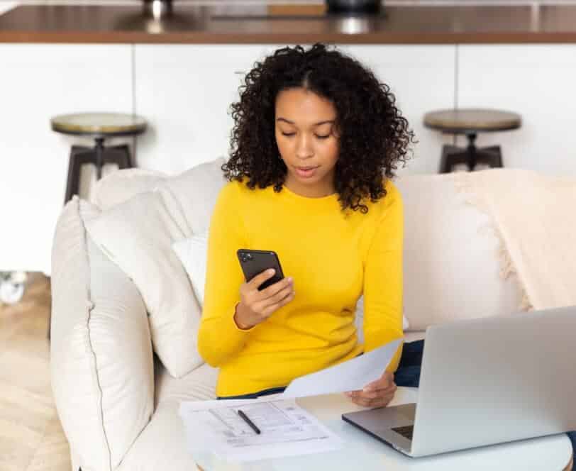 Woman using mobile EBPP solution for bill payment