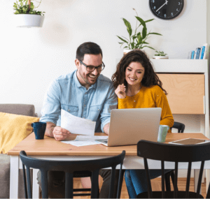 Happy couple making digital payments