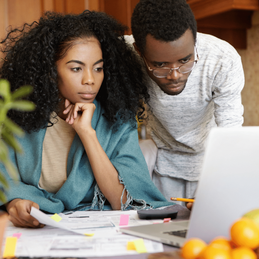 Young African American couple paying medical bills