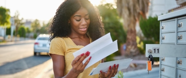 woman holding letters usps