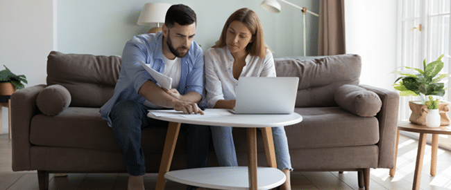 Print and Mail Outsourcing for Mortgage Statements with couple paying bills