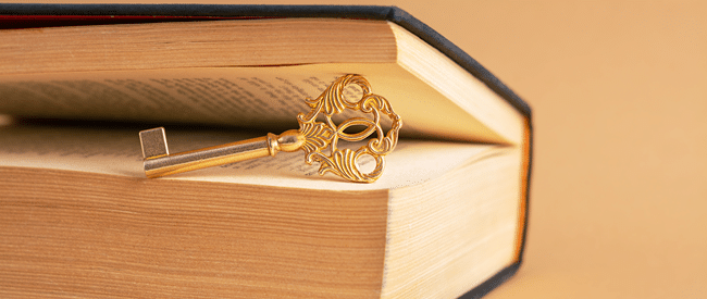 open book with key - writing Nordis' next chapter